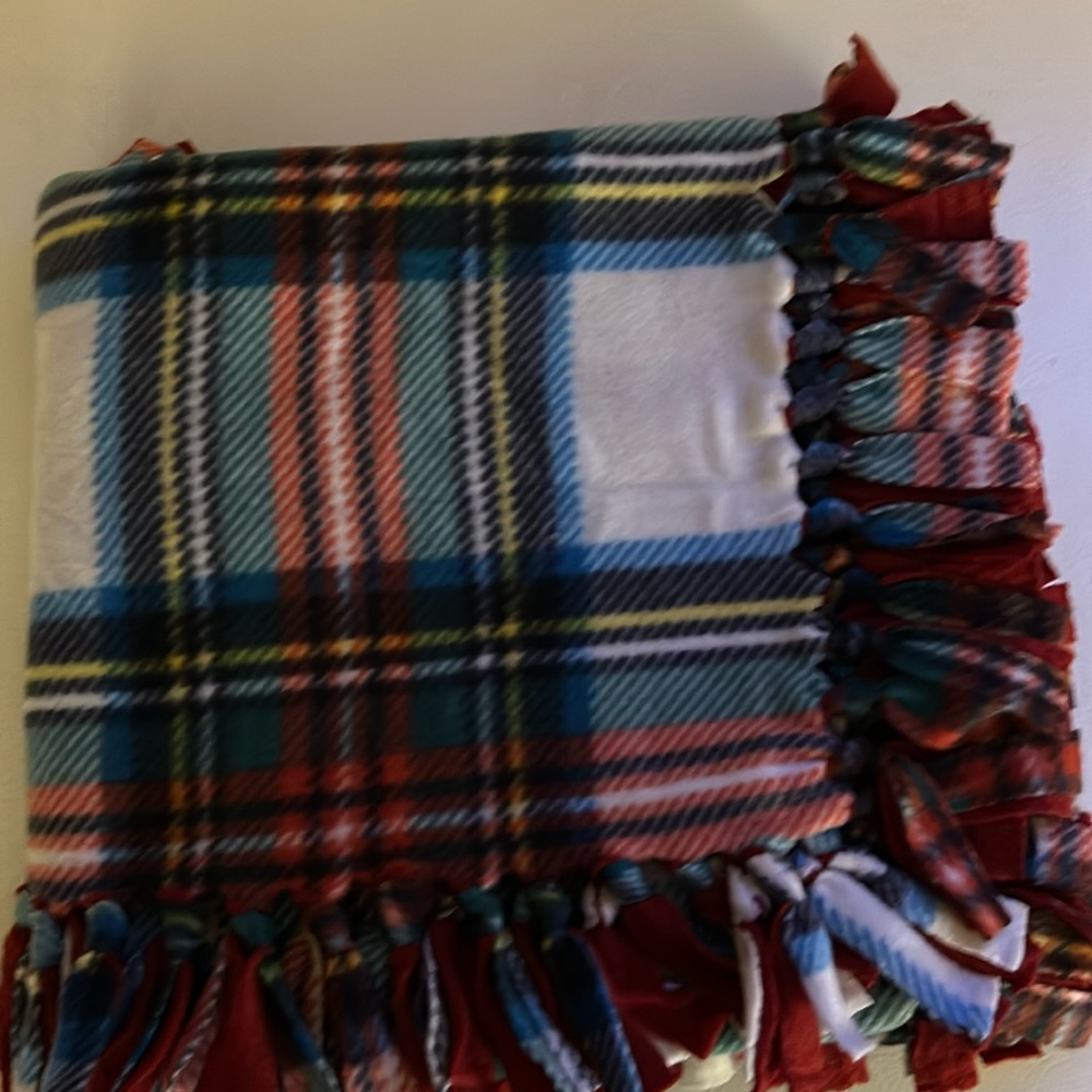 50x60” fleece tie blanket.  Red plaid fleece with red fleece backing.